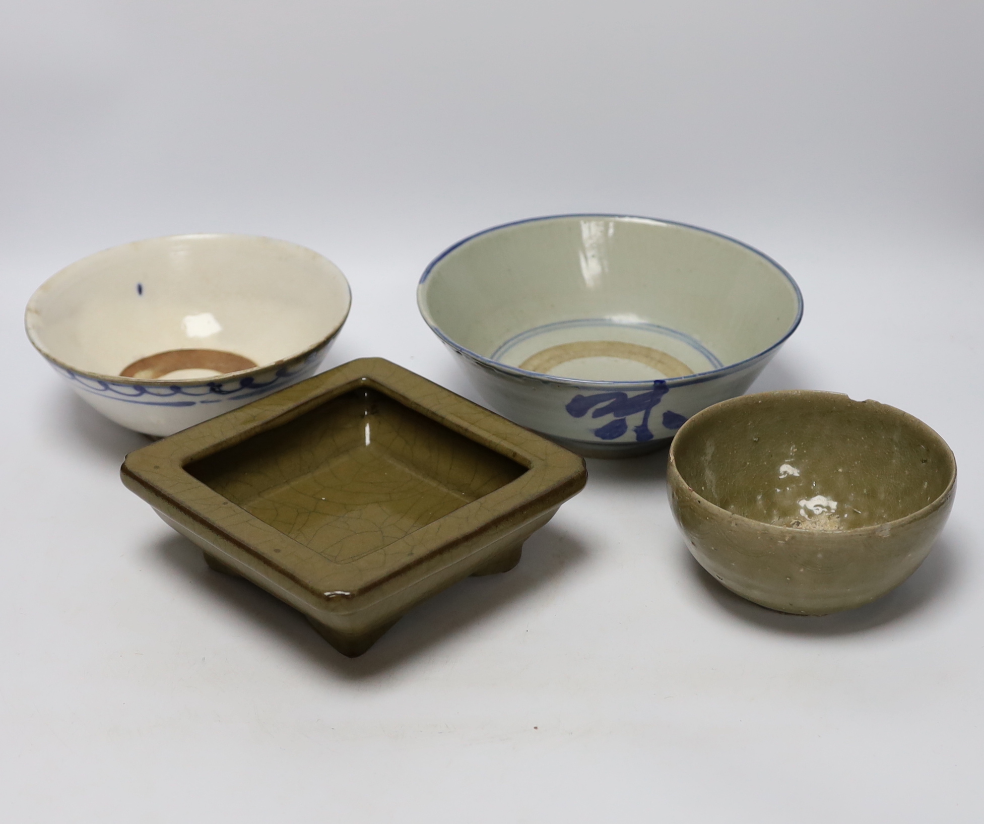 Three Chinese bowls including two blue and white examples, together with a ge ware type square dish, largest 20cm in diameter